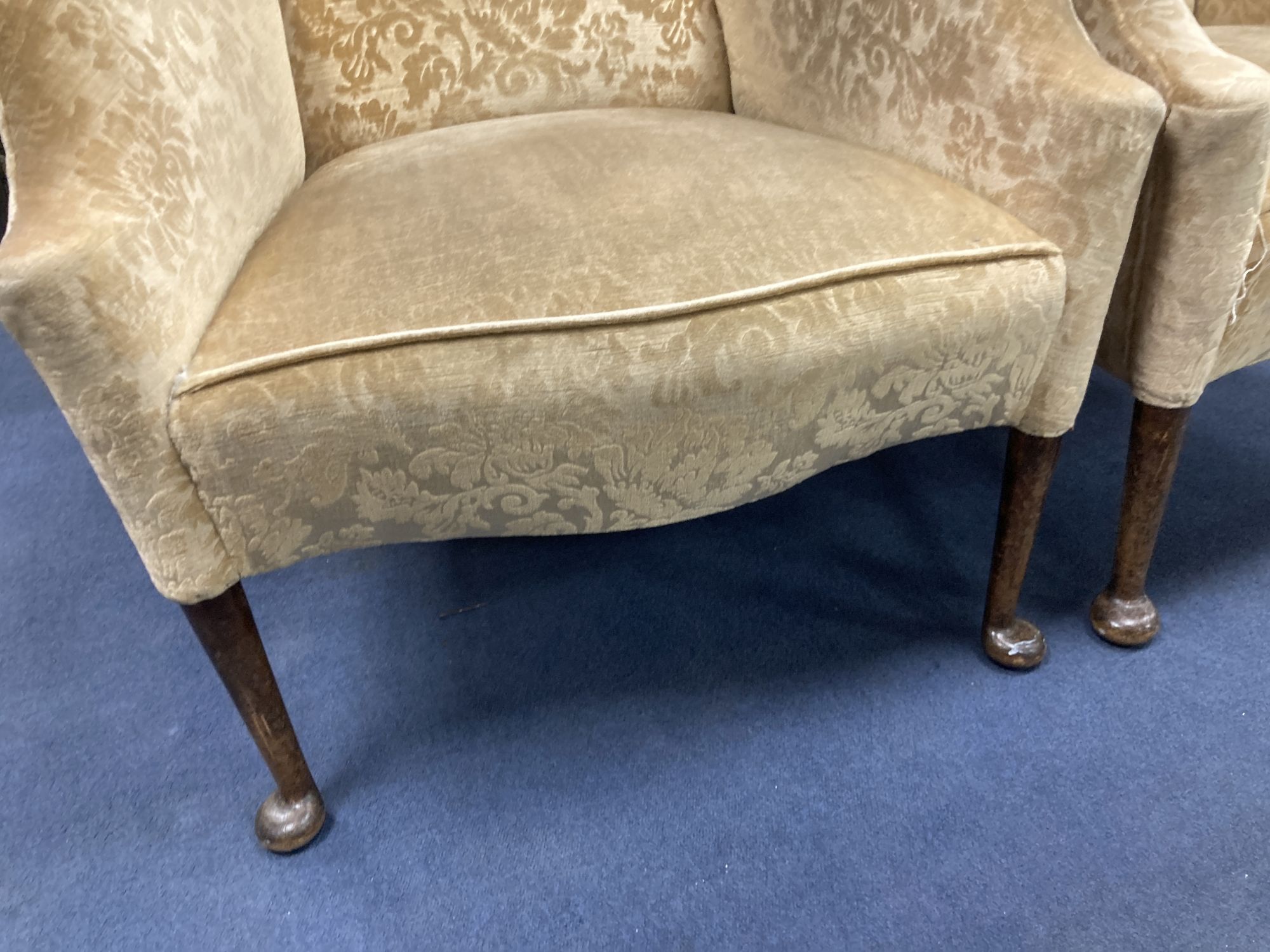 A pair of 1920s upholstered armchairs, width 70cm, depth 70cm, height 102cm